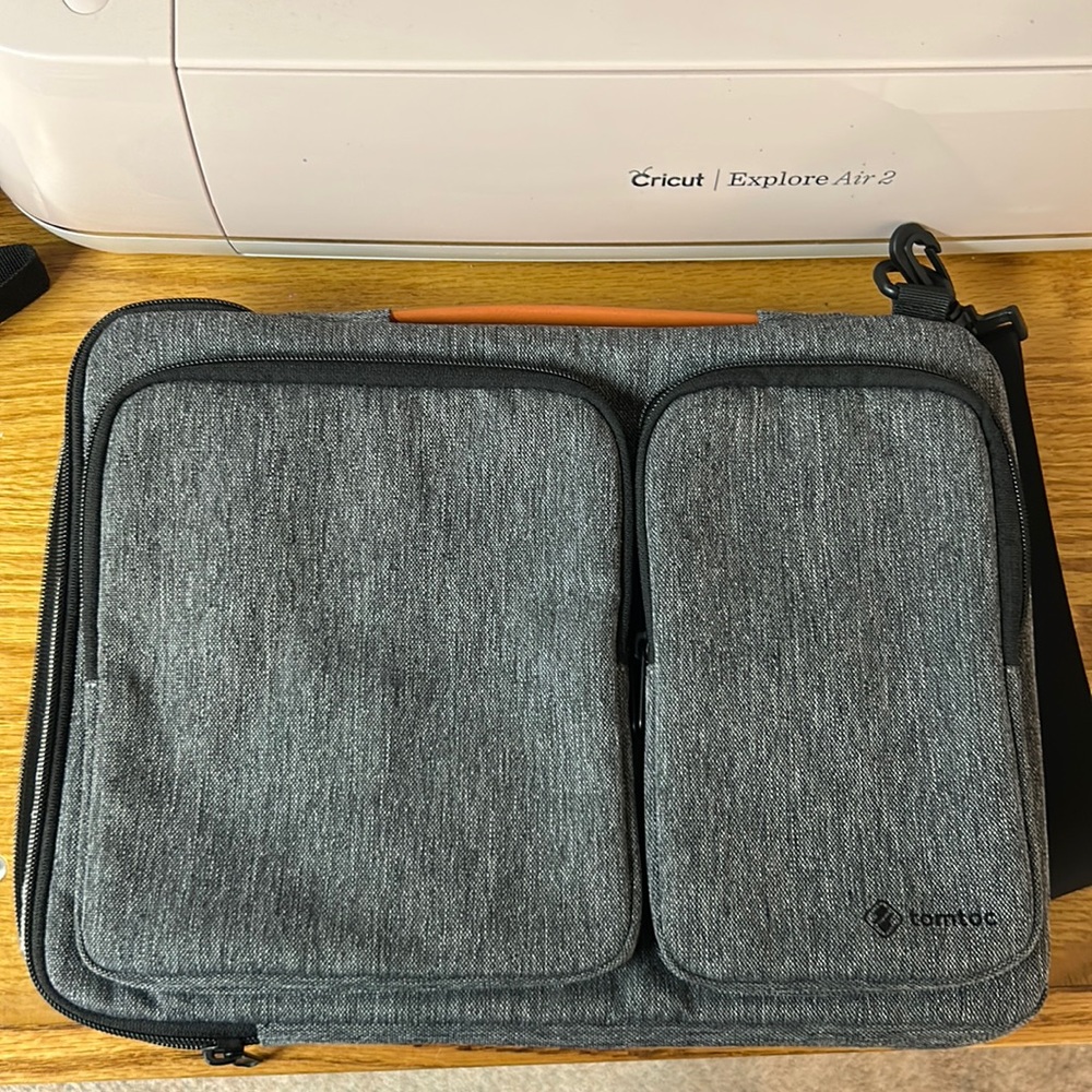 Tomtoc brand laptop bag with front storage gray color